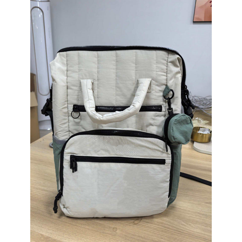 Multifunctional backpack with padded carrying handles and multiple compartments Bowlift