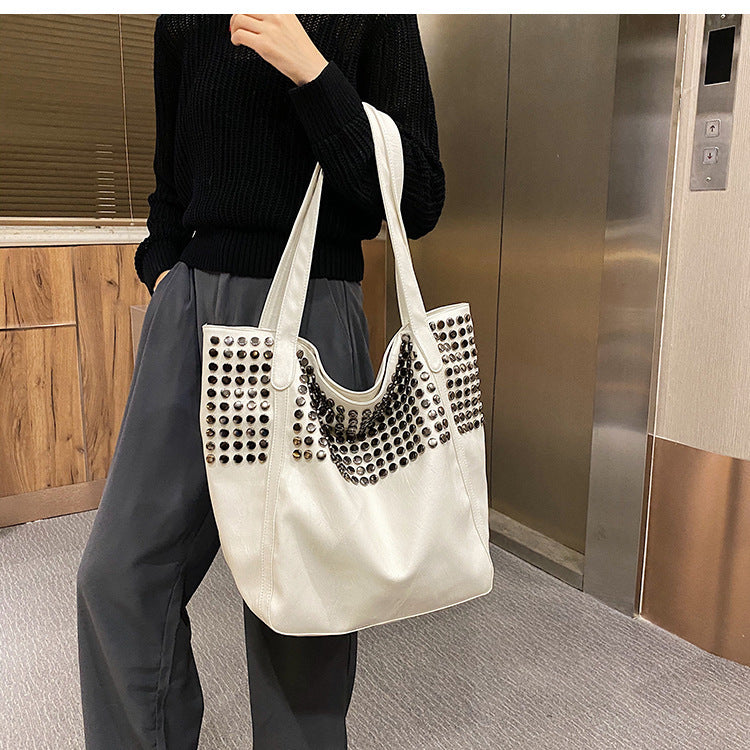 Fashionable shoulder bag with stylish rivet details Bowlift
