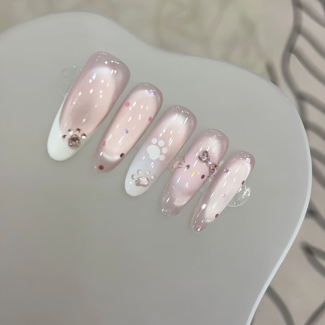 Artificial nail tips with playful penguin and paw print design Bowlift
