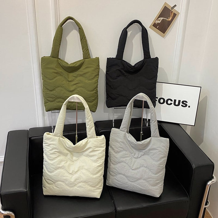 Padded shoulder bag with wave design Bowlift