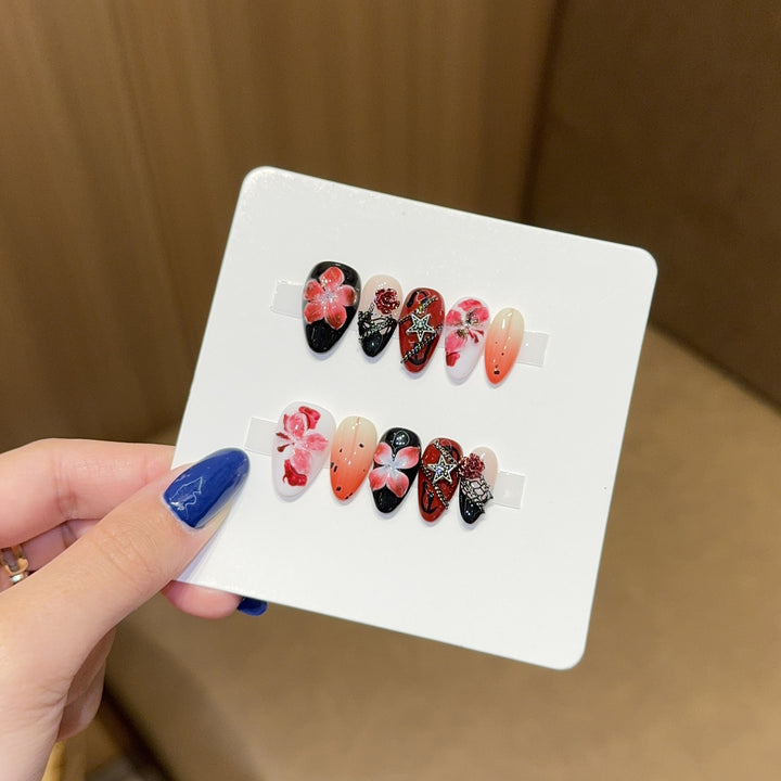 Art nail set with floral motifs and glitter accents Bowlift