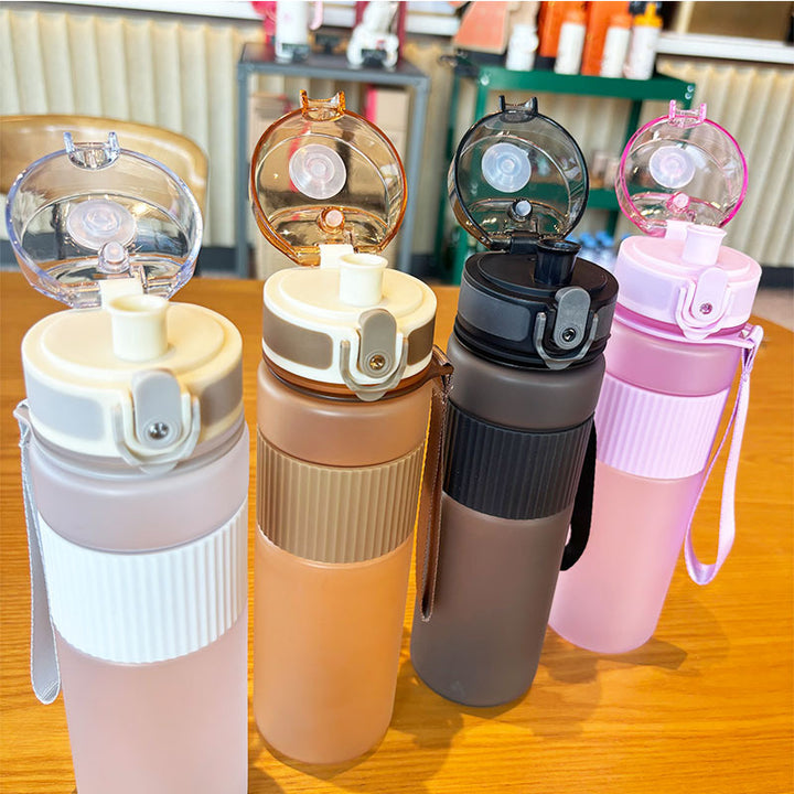 Ladies practical and leak-proof drinking bottle with integrated carrying strap Bowlift
