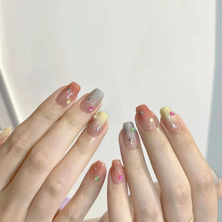 Glamorous artificial nails with moon and star motifs Bowlift
