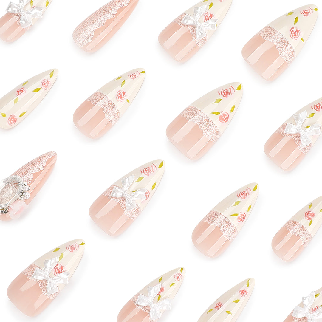 Artful stiletto nails with floral accents and glitter accents Bowlift