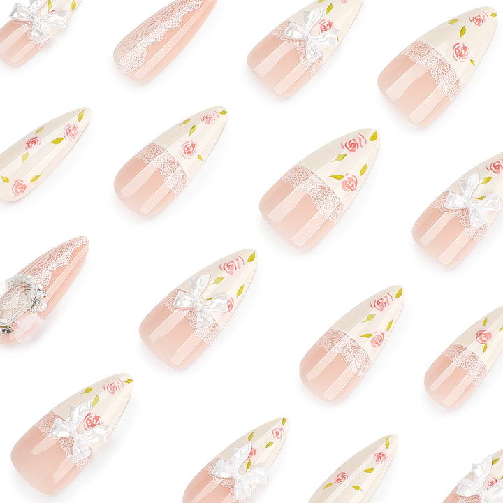 Artful stiletto nails with floral accents and glitter accents Bowlift