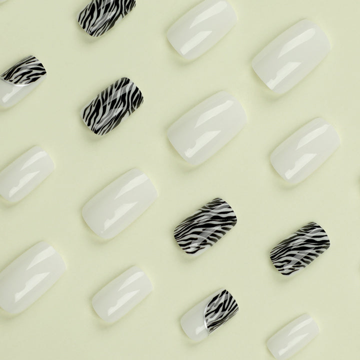 Artful nail extensions with stylish zebra pattern Bowlift