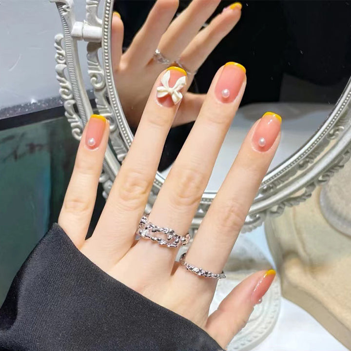 Art nails with elegant 3D flowers and glitter accents Bowlift