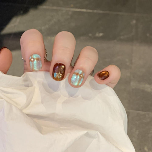 Artificial nail art tips with shimmer and glitter Bowlift