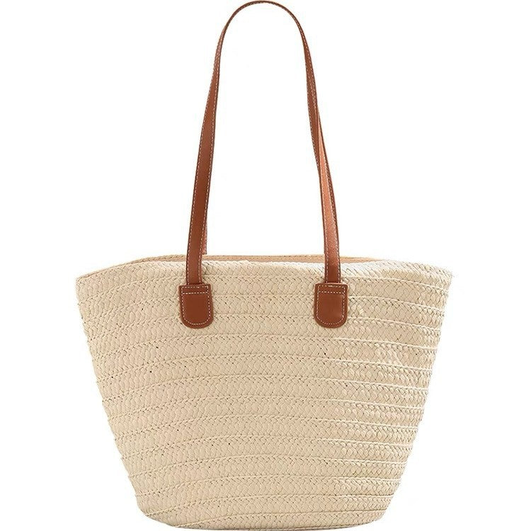 Stylish beach bag made of woven natural material with leather handles Bowlift