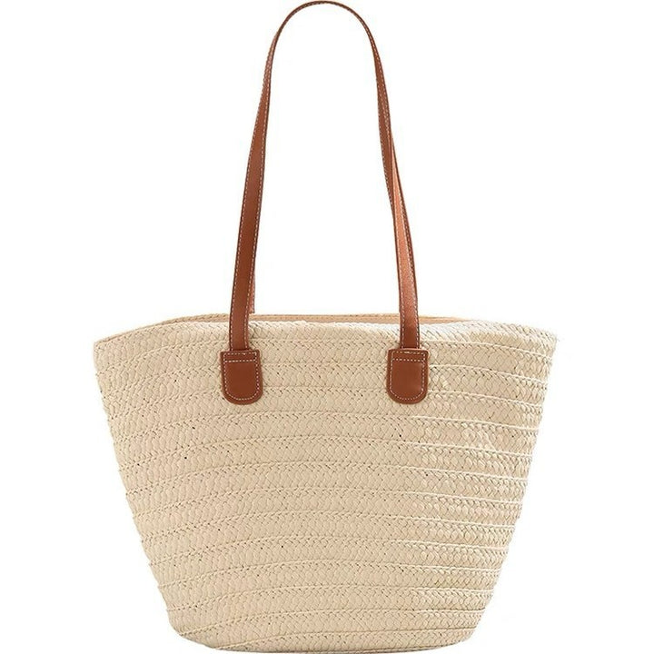 Stylish beach bag made of woven natural material with leather handles Bowlift