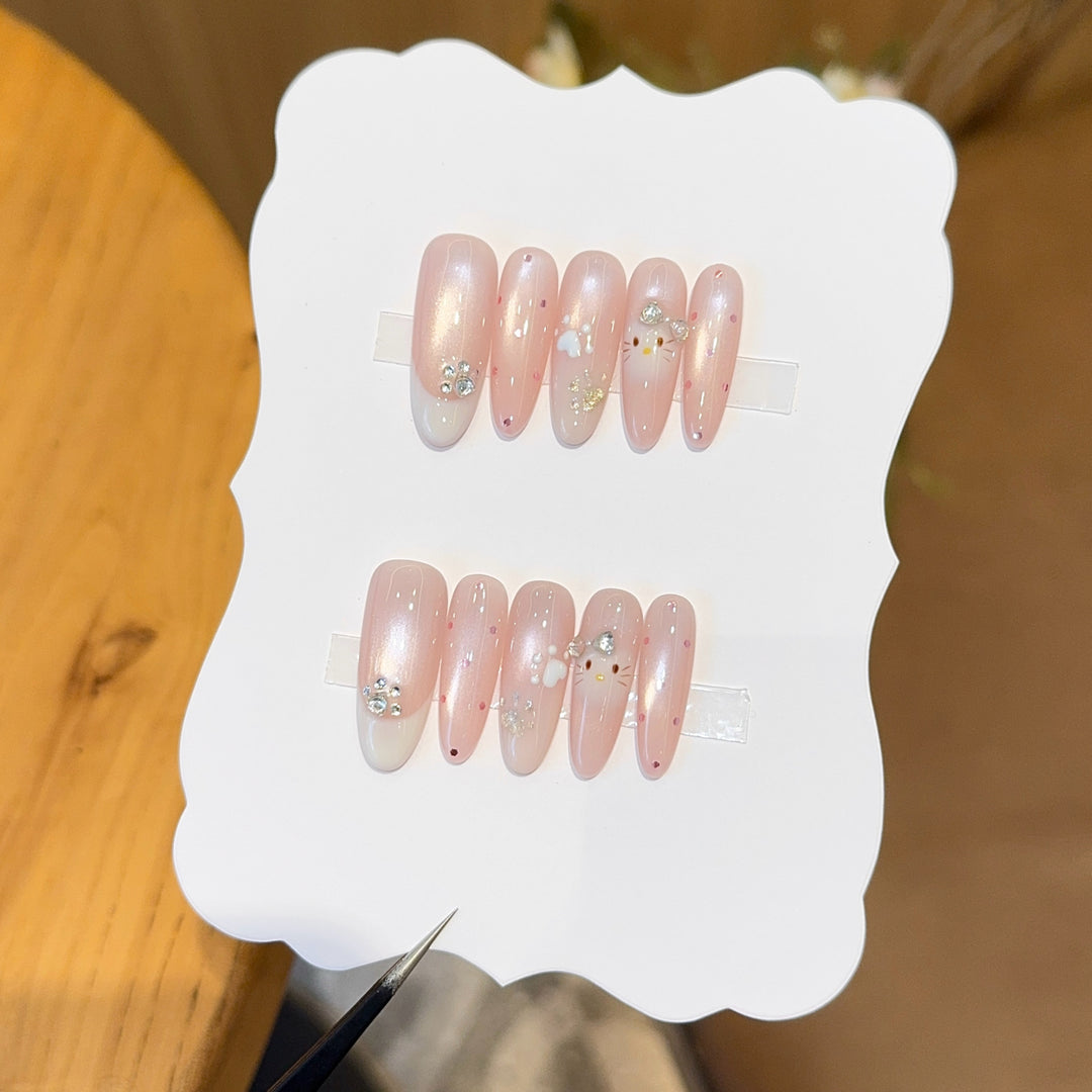 Artificial nail tips with playful penguin and paw print design Bowlift