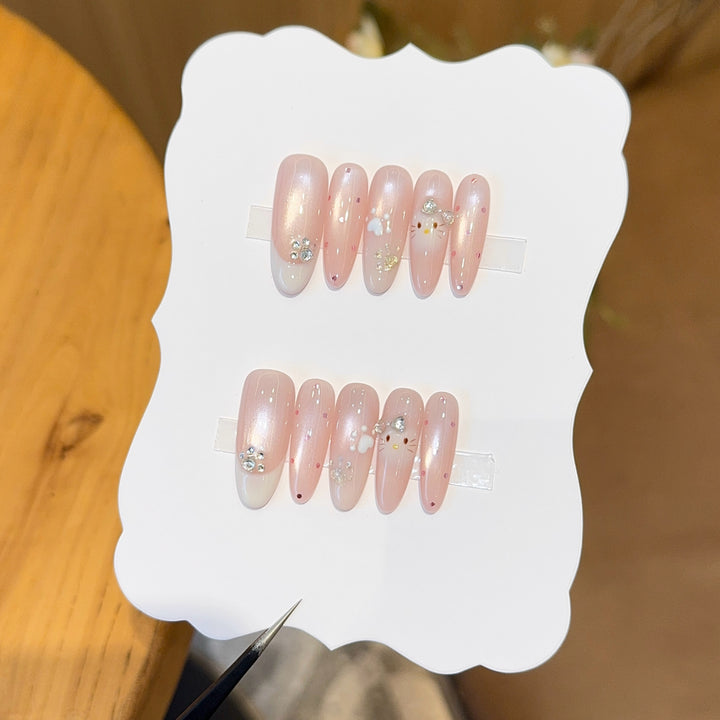 Artificial nail tips with playful penguin and paw print design Bowlift