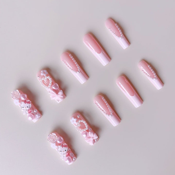 Acrylic nail set with playful 3D accents and pearl details Bowlift