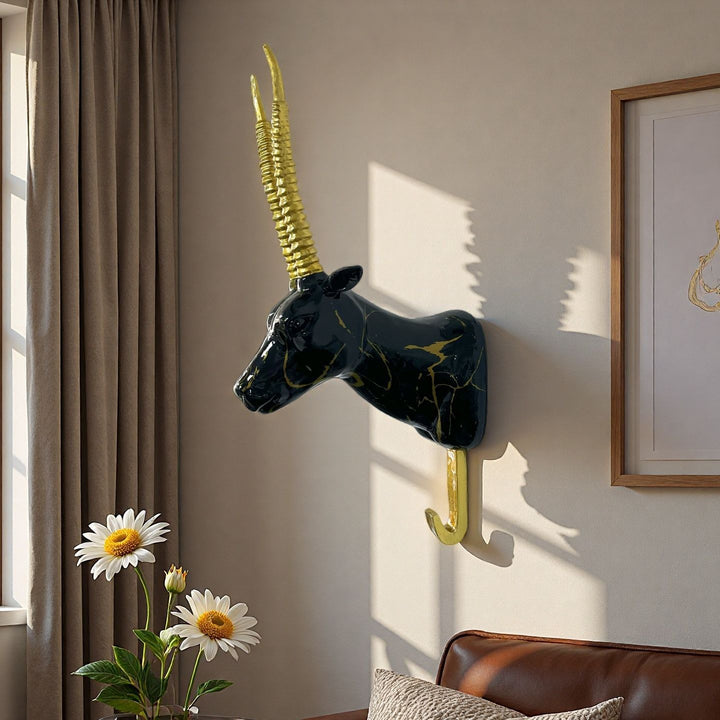 Wall hooks in the shape of a stylized unicorn Bowlift