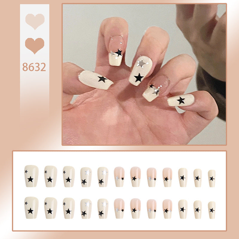 Artificial nail set with glamorous star design and sparkling accents Bowlift