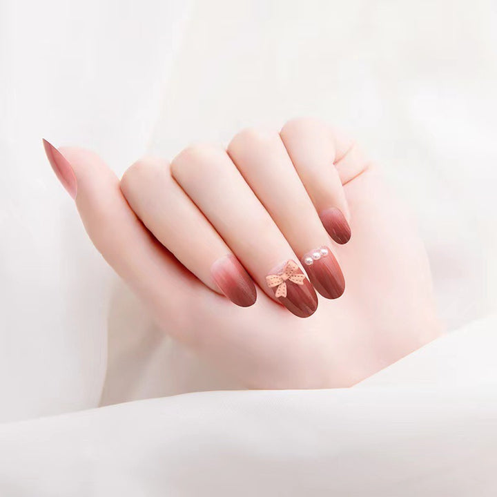 Artificial nails with glamorous bow and pearl decor Bowlift