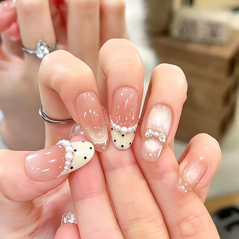Artificial nail set with elegant French design and delicate pearl embellishments Bowlift