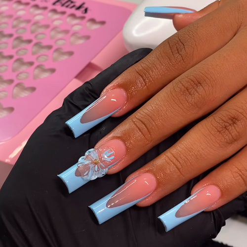 Artistic Long Press-On Nails with Floral Accents Bowlift