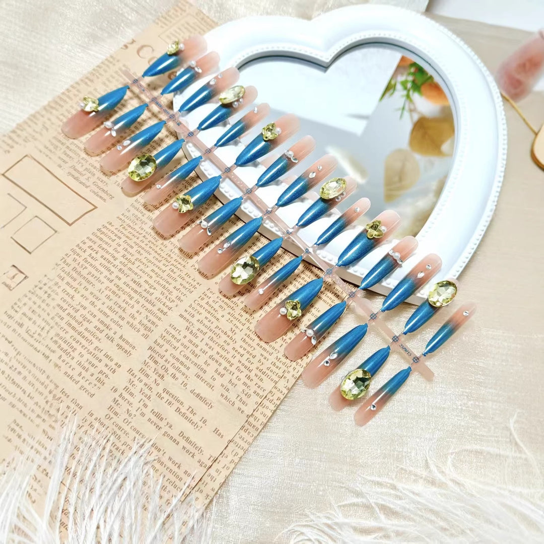 Artificial nails with glamorous stone applications Bowlift