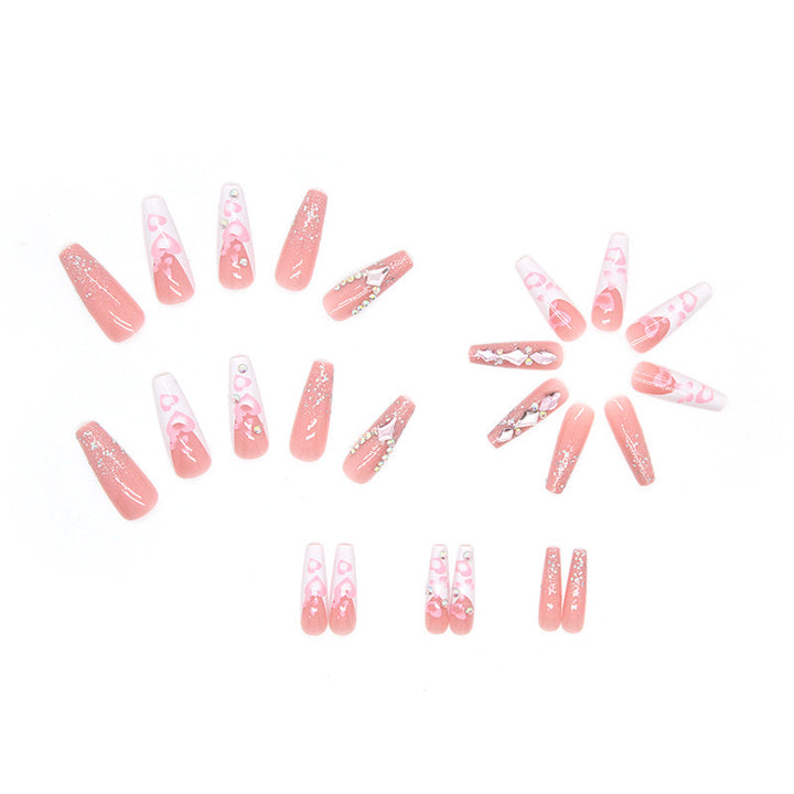 Glamorous artificial nails with heart and glitter patterns