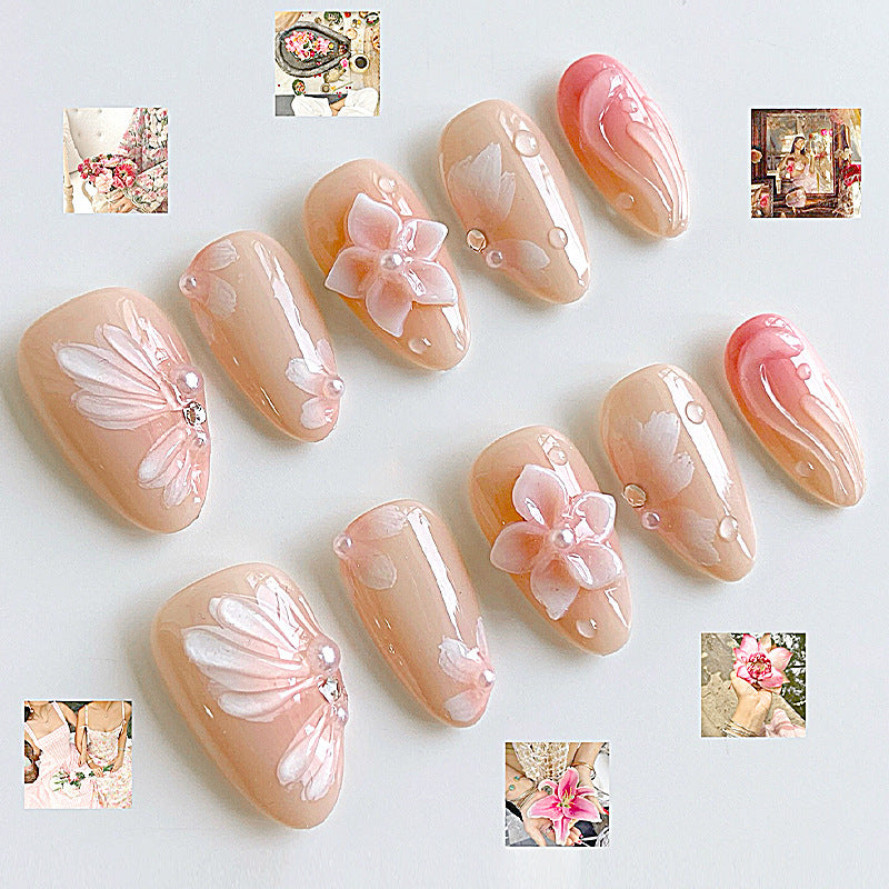 Artificial nail set with floral motifs and rhinestone decorations Bowlift