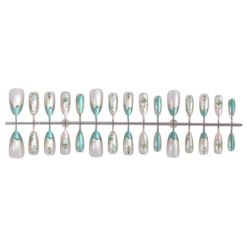 Artificial nail set with luxurious flower appliqués and glitter accents Bowlift