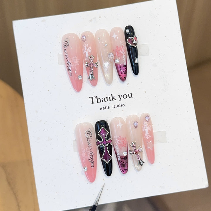 Artificial nails with glamorous accents and sparkling embellishments Bowlift