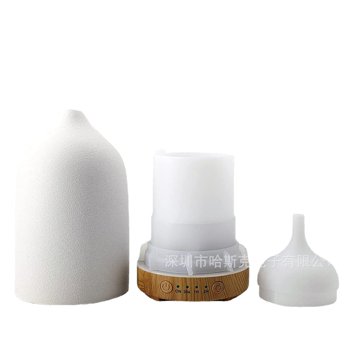 Ultrasonic essential oil diffuser with wood grain base and matte textured ceramic cover Bowlift