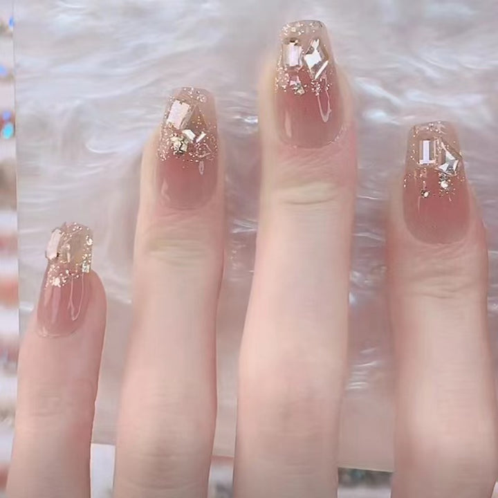 Glamorous artificial nails with delicate flower and glitter effects Bowlift
