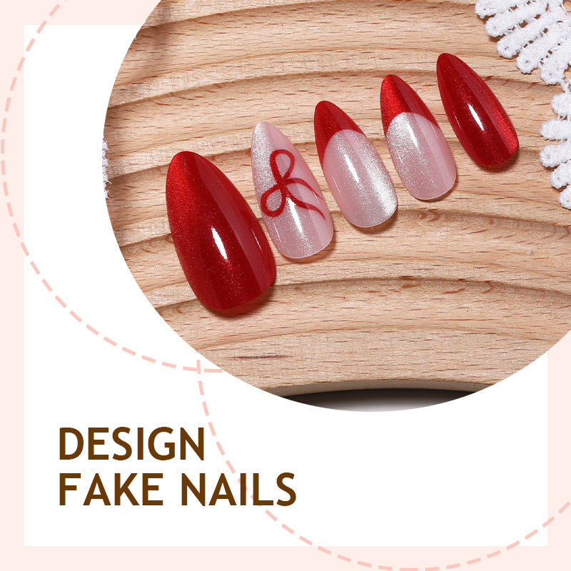 Artificial nail set with elegant red and delicate bow accents Bowlift