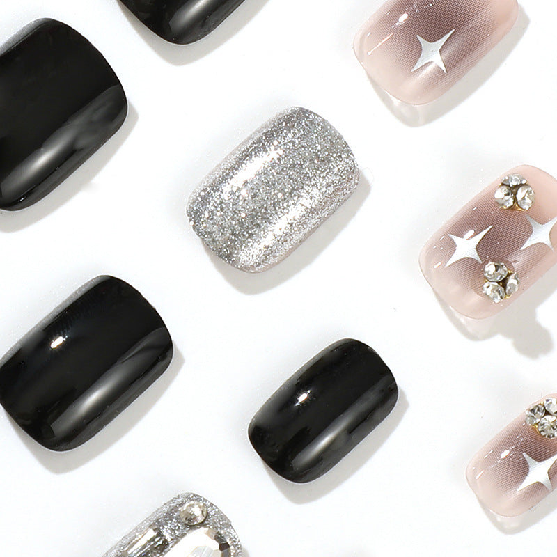 Elegant Nail Art with Glitter and Star Motifs Bowlift