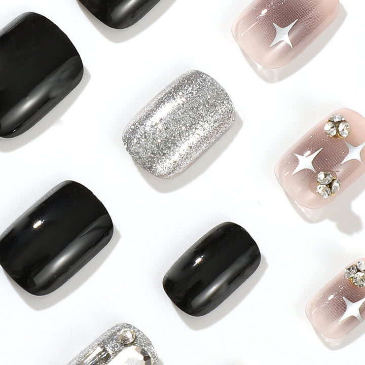 Elegant Nail Art with Glitter and Star Motifs Bowlift