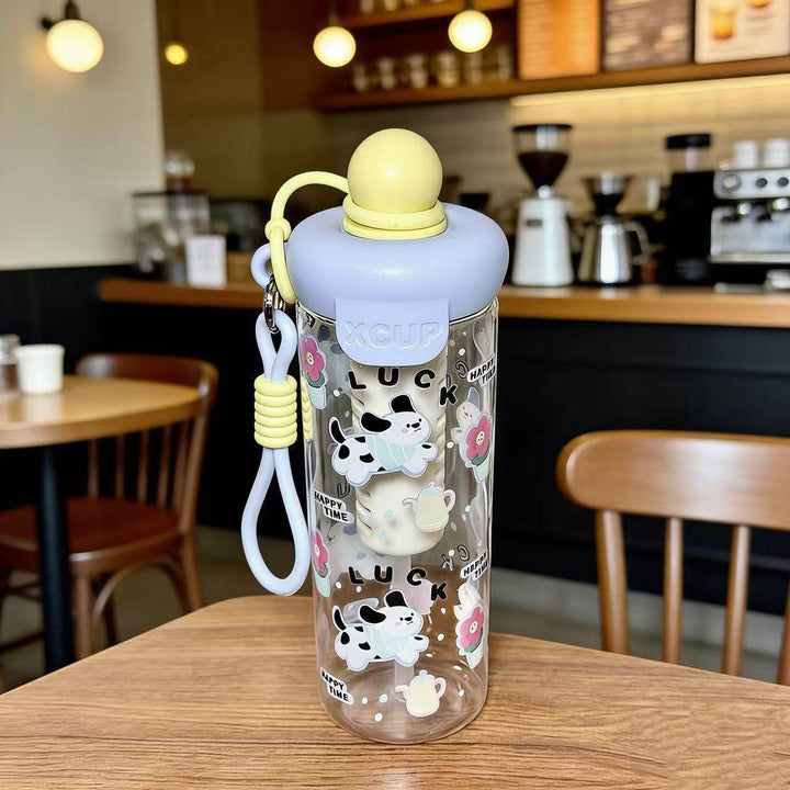 Women's water bottle with cheerful design and practical carrying handle Bowlift