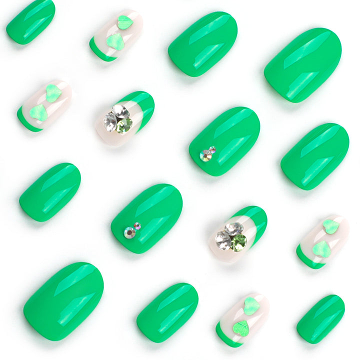 Artistic Nail Extensions with Lovable Heart Patterns and Glitter Accents Bowlift