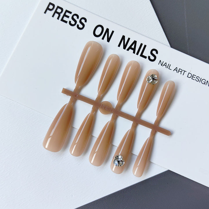 Acrylic nails with glamorous stone accents Bowlift