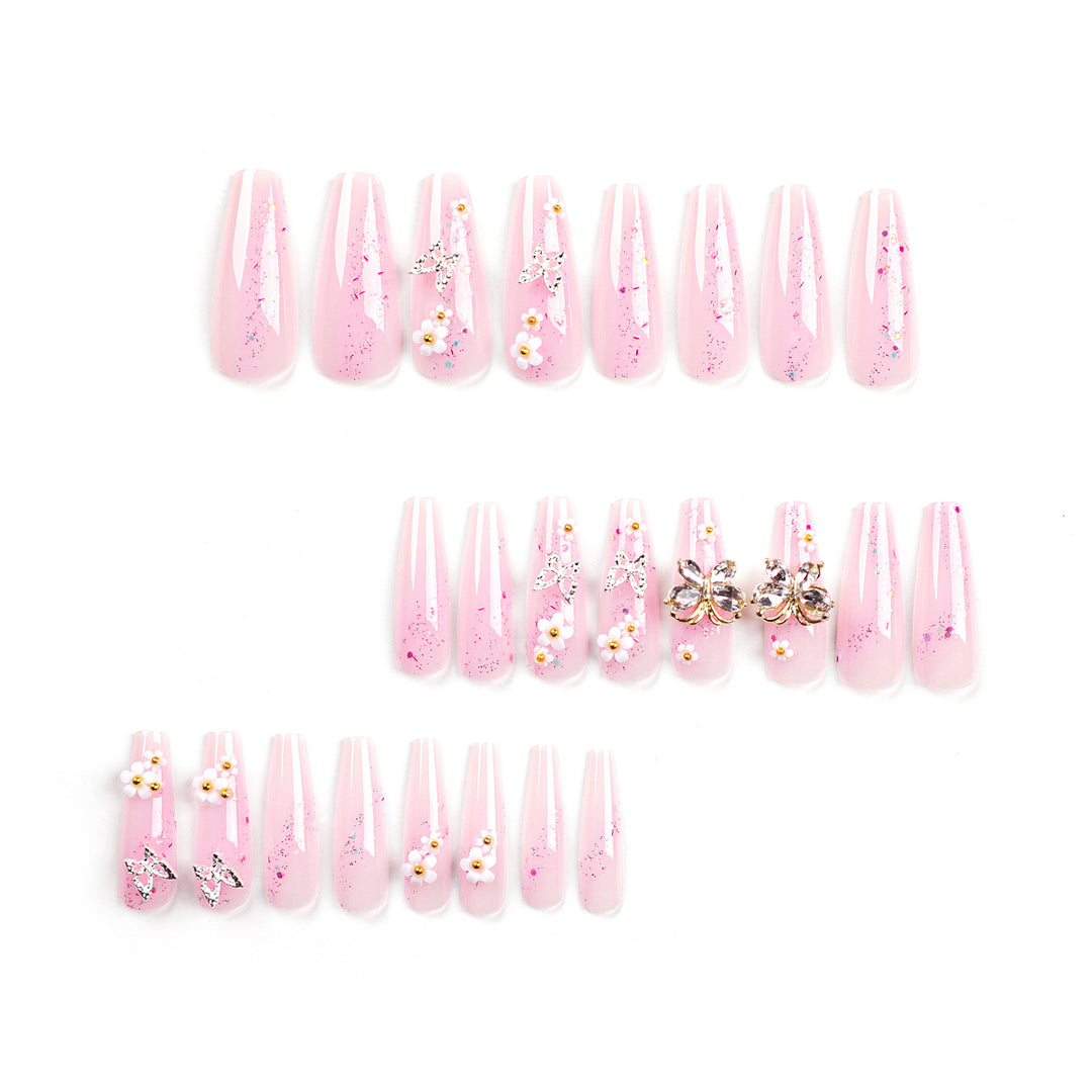 Artistic Nail Extensions with Glitter and Floral Accents Bowlift