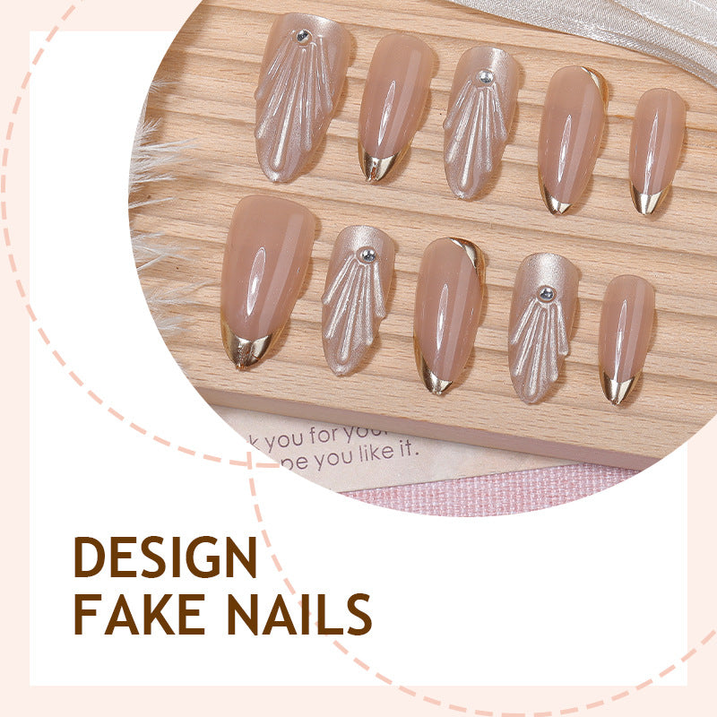 Artificial nail set with elegant gold tips and artistic decorations Bowlift
