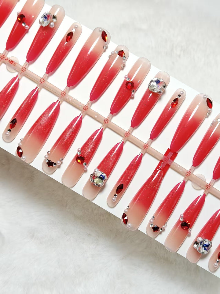 Artificial nails with glamorous glitter and rhinestone embellishments Bowlift