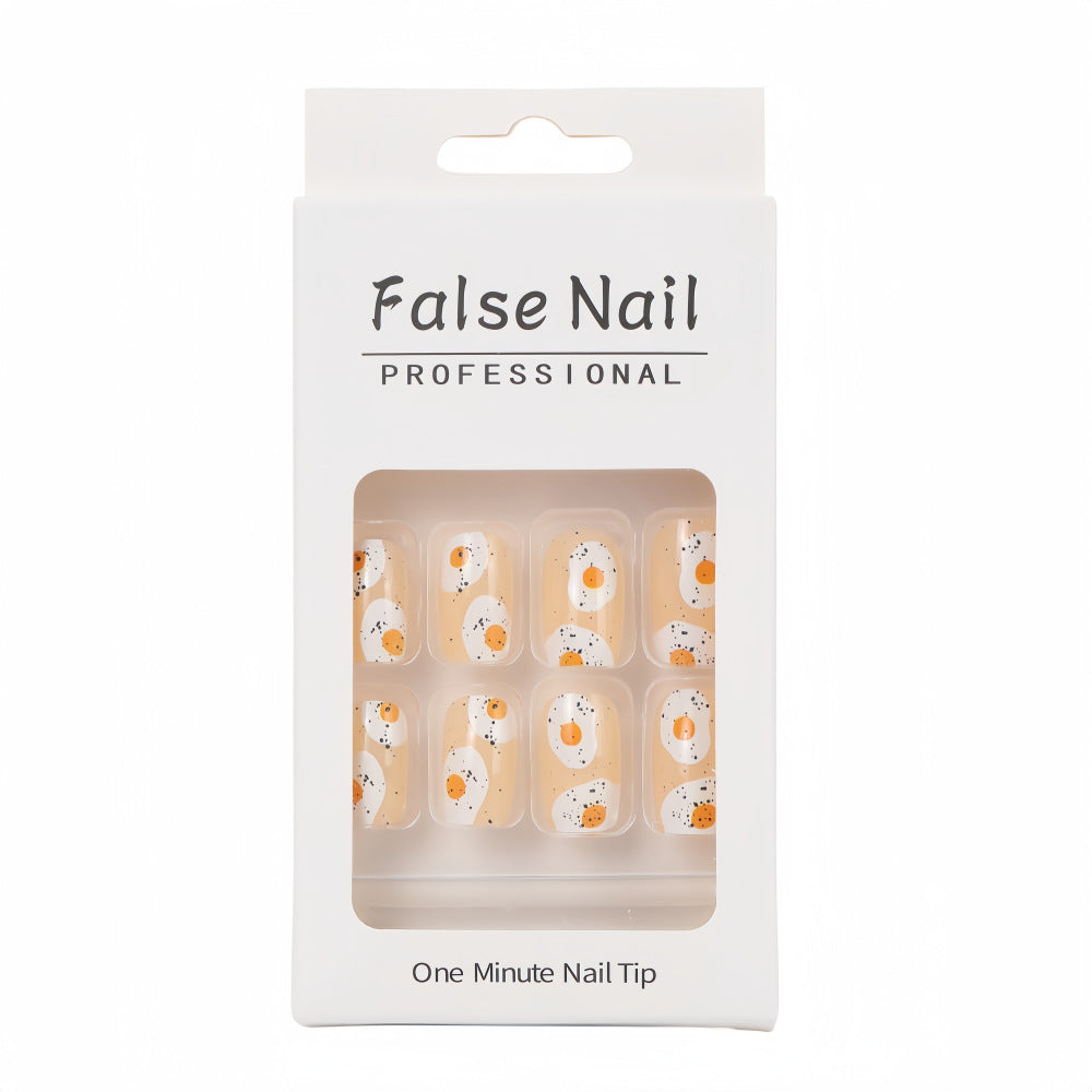 Artificial nails in creative fried egg design Bowlift