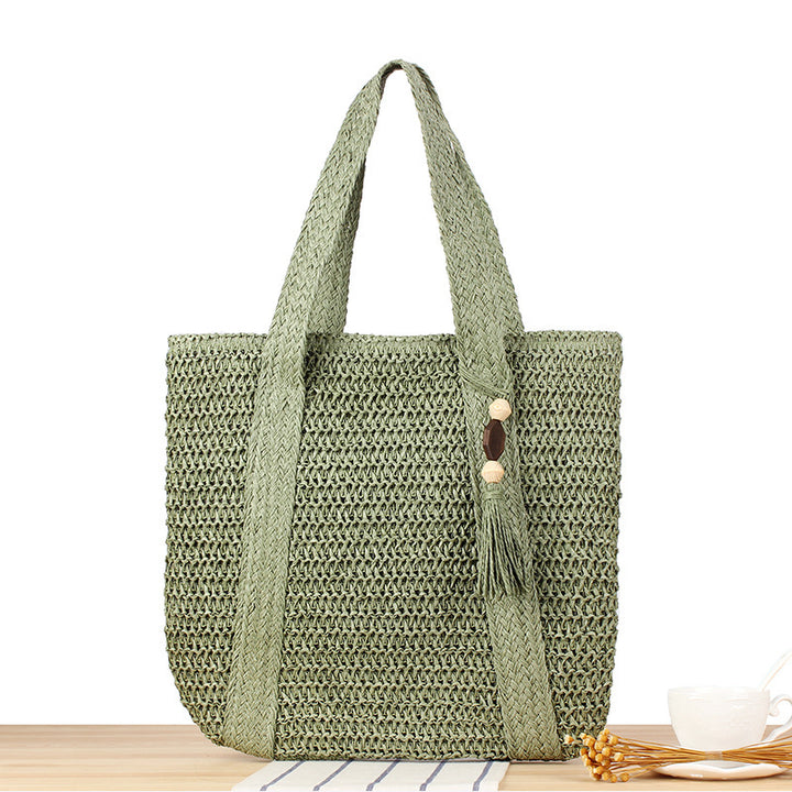 Eco-friendly straw tote bag with elegant tassel detail Bowlift