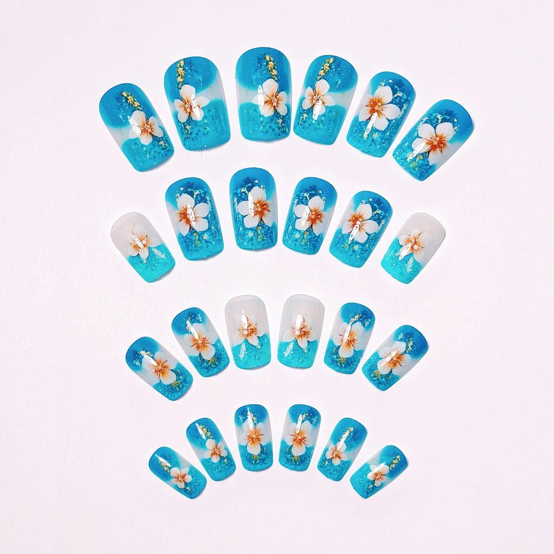 Artificial nails with floral accents and glitter patterns Bowlift