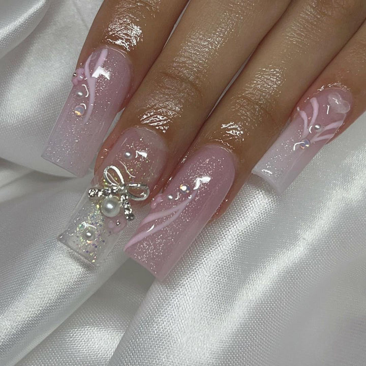 Artistic acrylic nails with elegant jewelry accents Bowlift