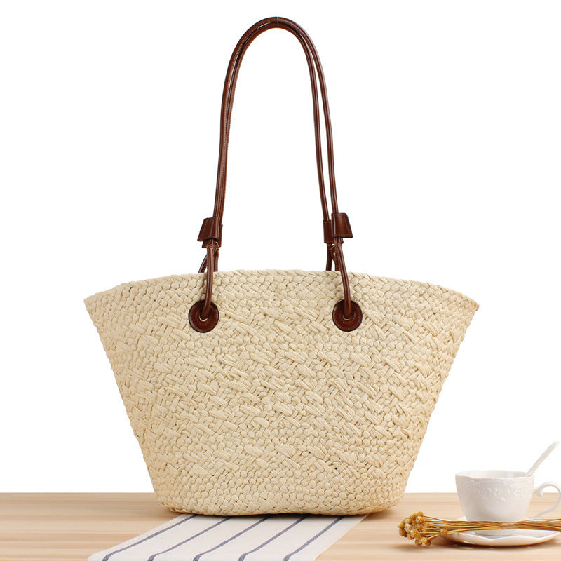 Beach bag made of high-quality braided straw with stylish leather handles Bowlift