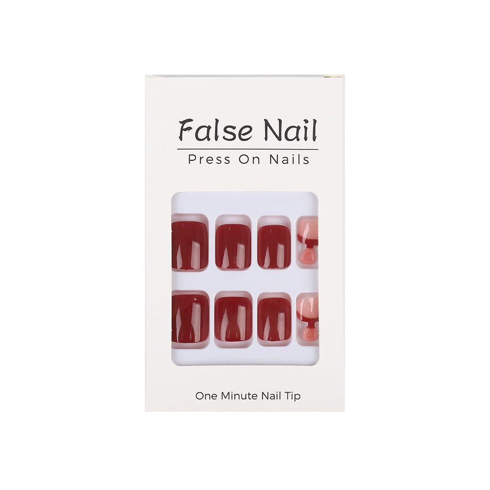 Acrylic nail set in elegant red and nude design Bowlift