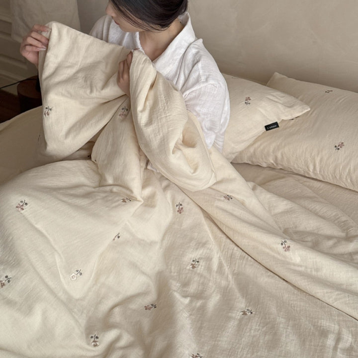 Linen bedding set with subtle floral embroidery