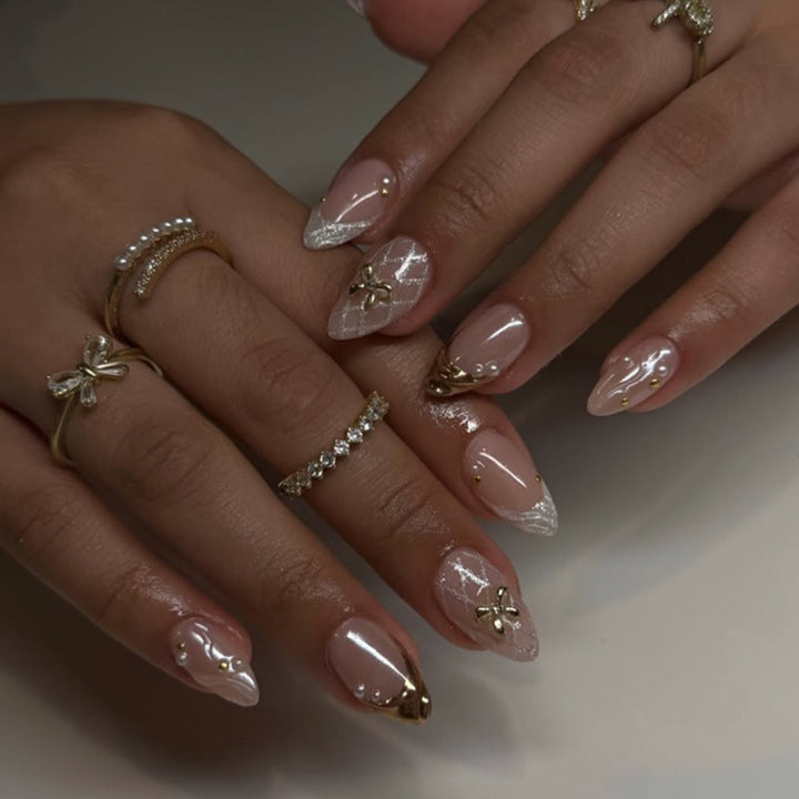 Artful stiletto nails with glitter and flower accents Bowlift
