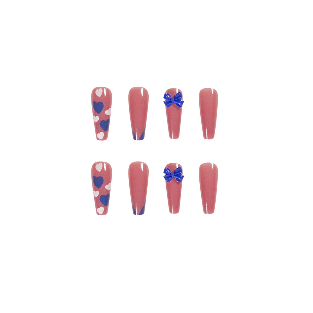 Artful stiletto nails with modern heart and bow motifs Bowlift