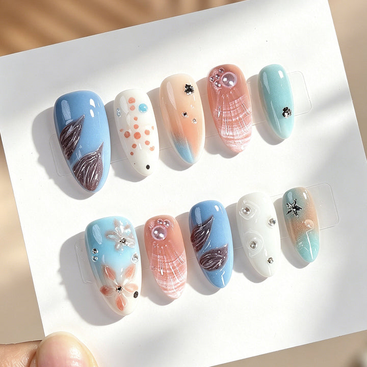 Creative nail art set with delicate floral and maritime designs Bowlift