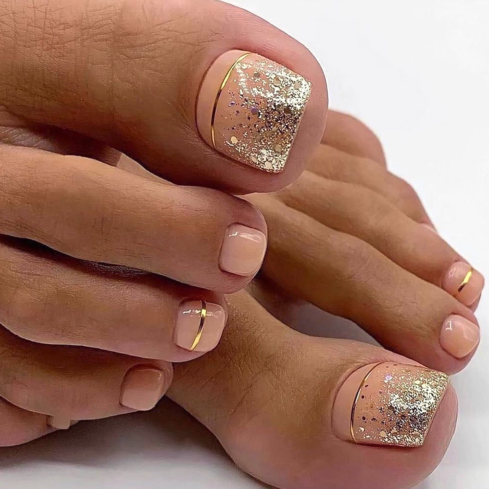 Artful toenail decoration with elegant gold accent Bowlift
