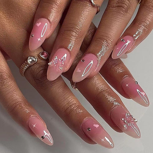 Artful nail art with heart motifs and glitter accents Bowlift